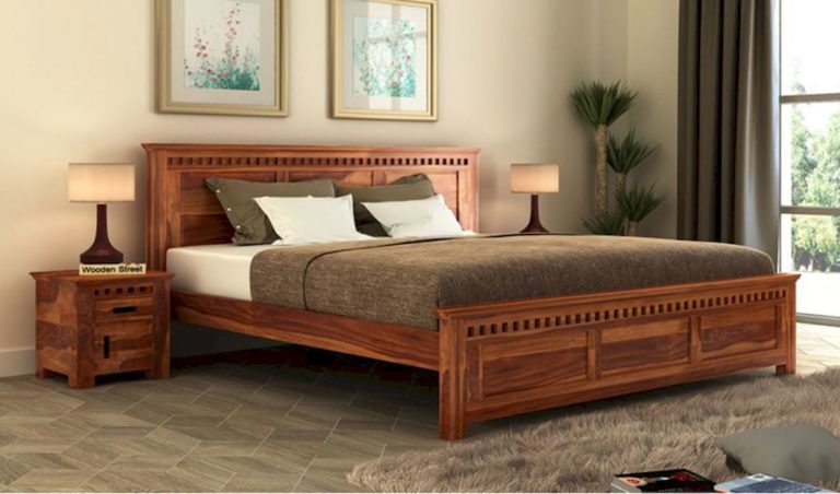 King size wooden bed with homey finish coloring via Wooden Street